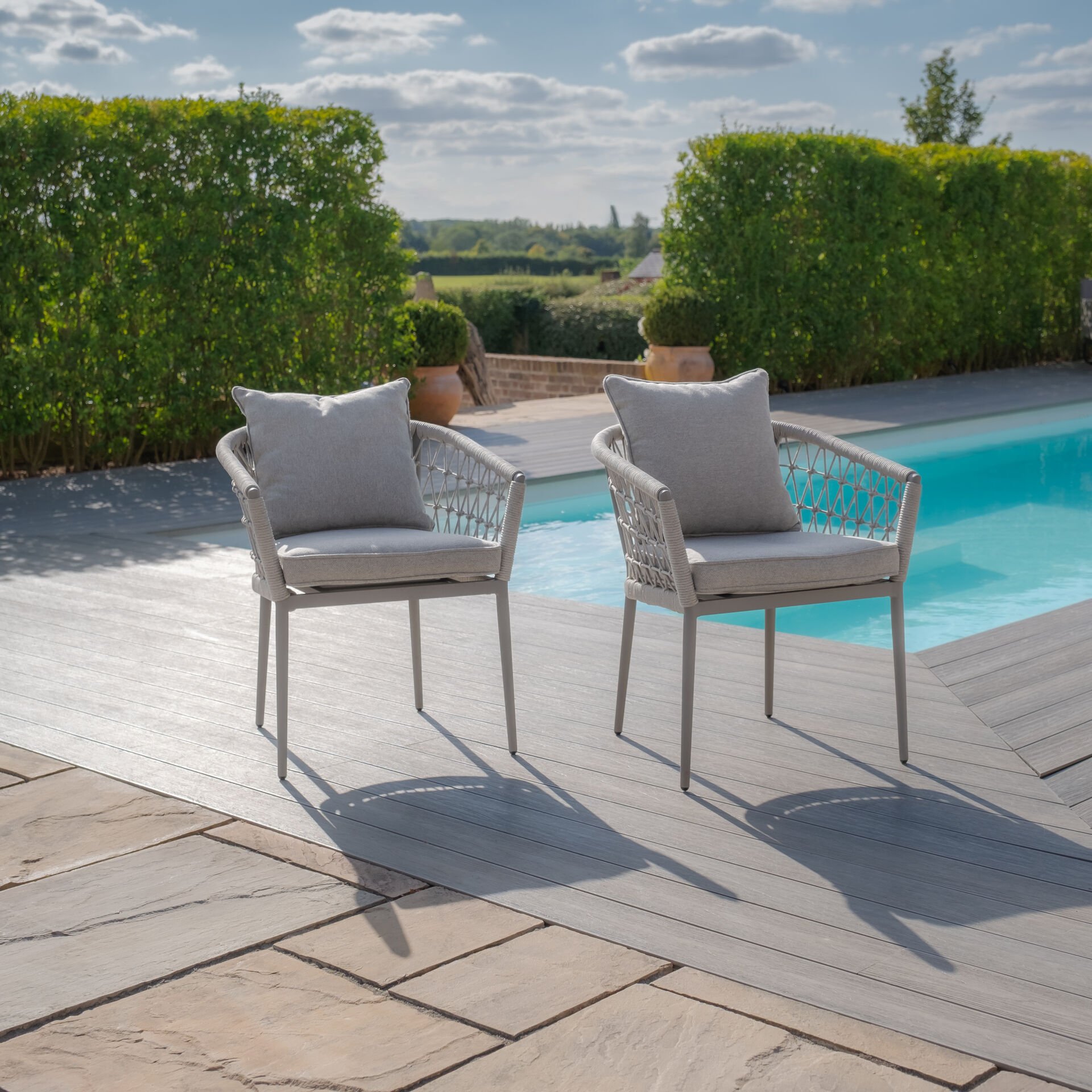 Maze - Jakarta Teak Extending 6 - 10 Seat Rectangular Dining Table with 10 Monaco Cool Linen Rope Weave Dining Chairs product image